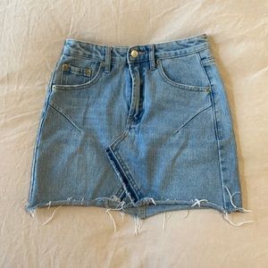 Distressed denim mini skirt